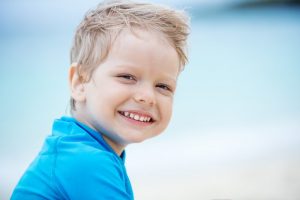 Young boy smiling.