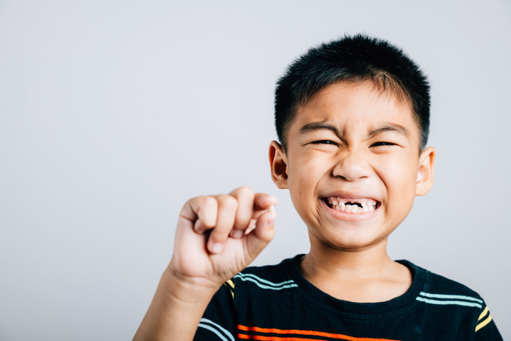 Boy with missing tooth
